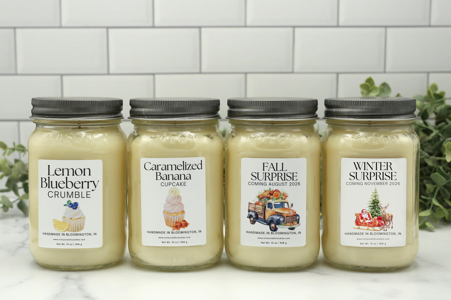 Four Candle Club candles for spring, summer, fall, and winter in 16 oz mason jars with silver lids displayed side by side