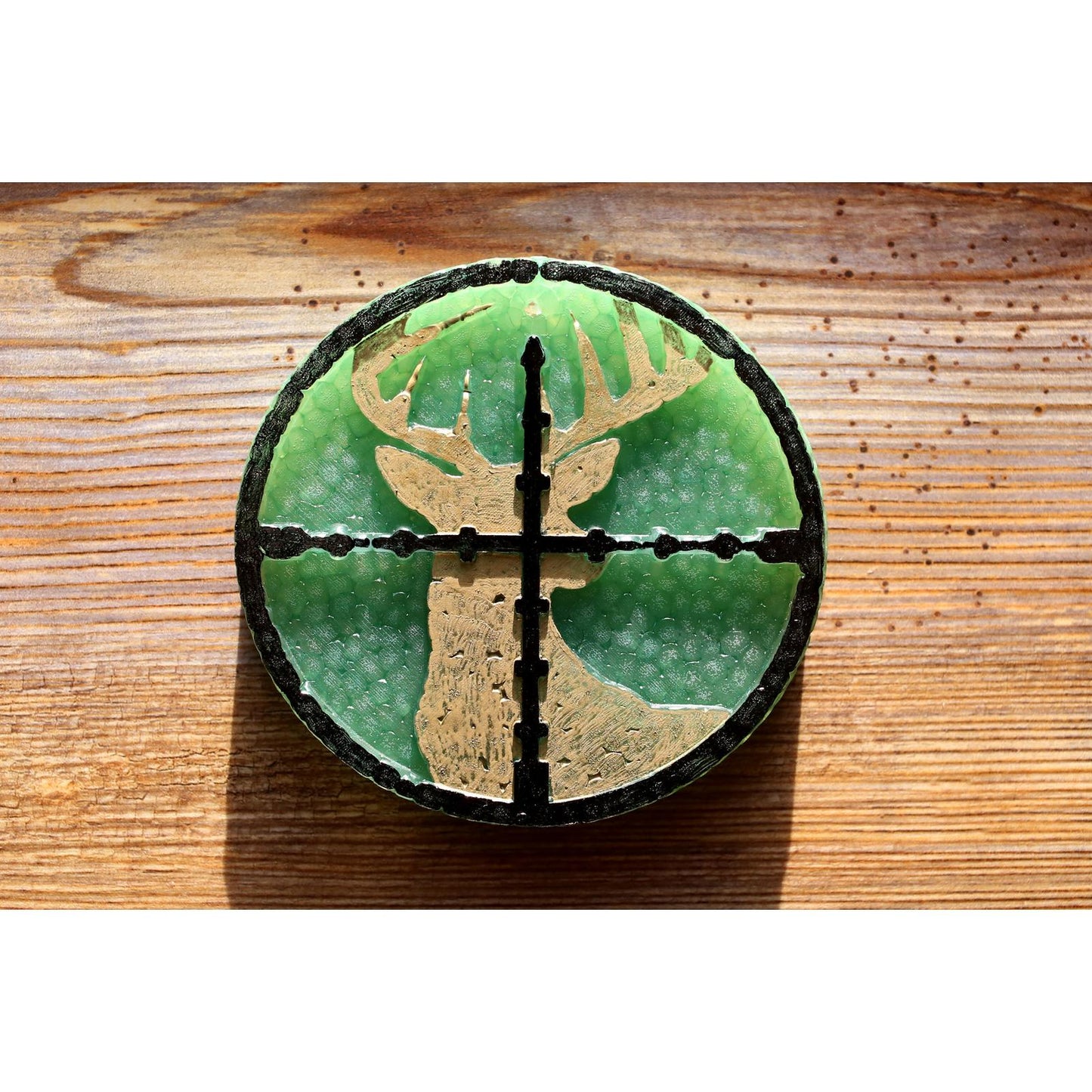 Green round car freshie featuring a buck silhouette centered in crosshairs, a bold choice for hunters and outdoorsmen