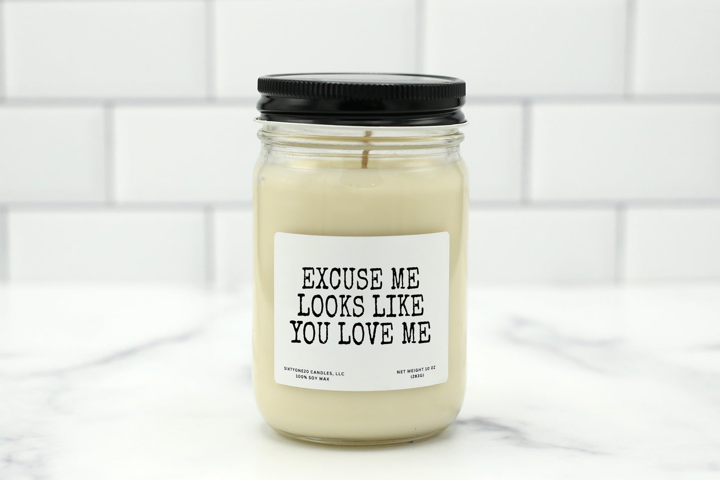 Soy wax candle with the label "Excuse Me, Looks Like You Love Me" – a flirty, fun gift for anniversaries or just because.