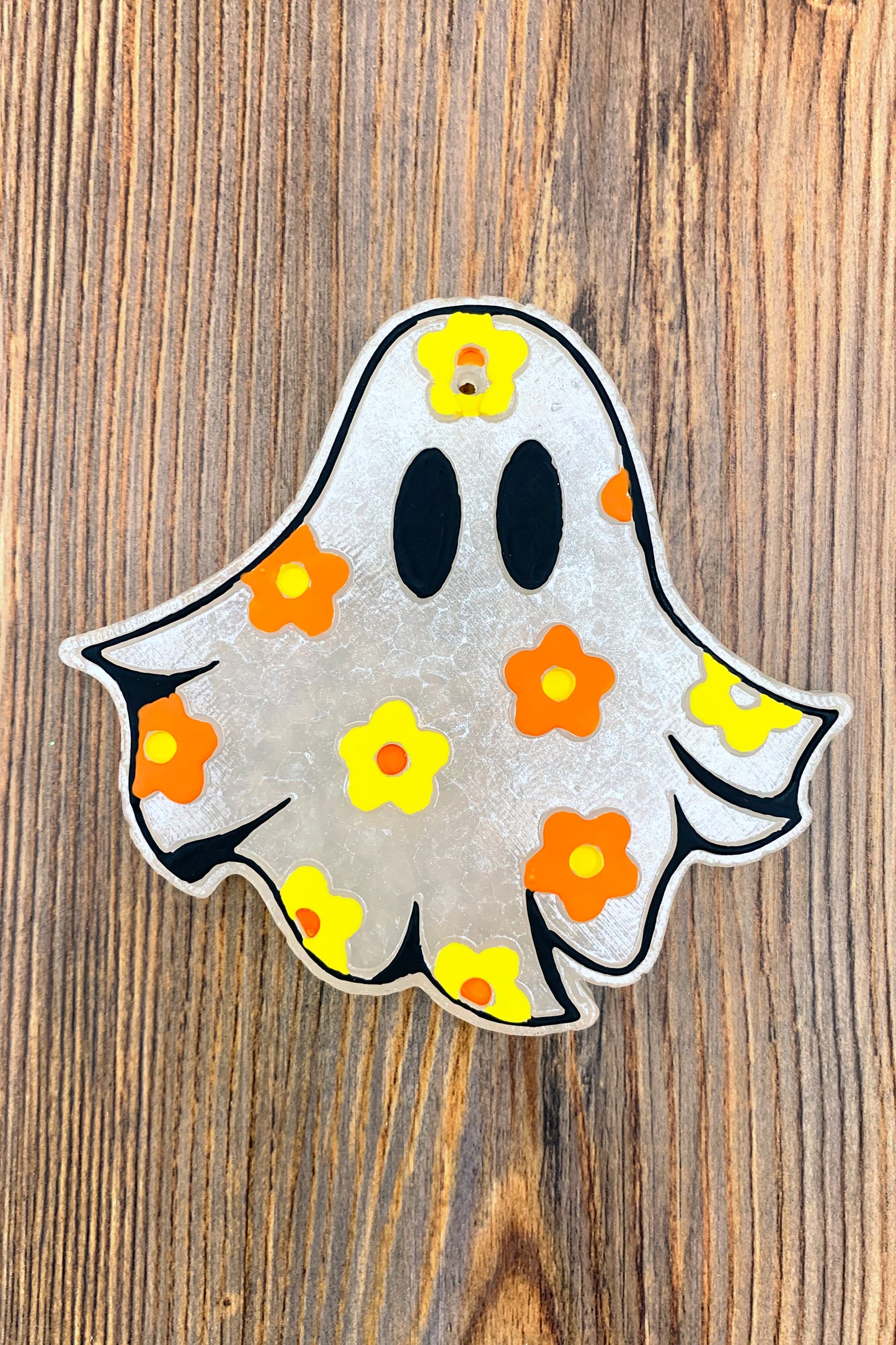 ghost car freshie that has painted daises on it