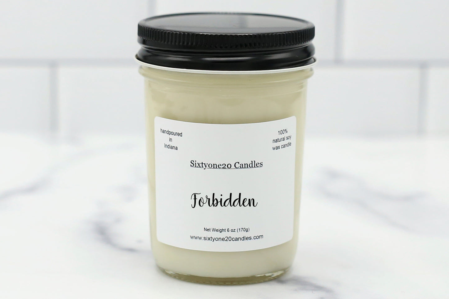 “Forbidden” candle in a jelly jar with natural soy wax and a masculine fragrance blend of lavender, vanilla, woods, and musk.