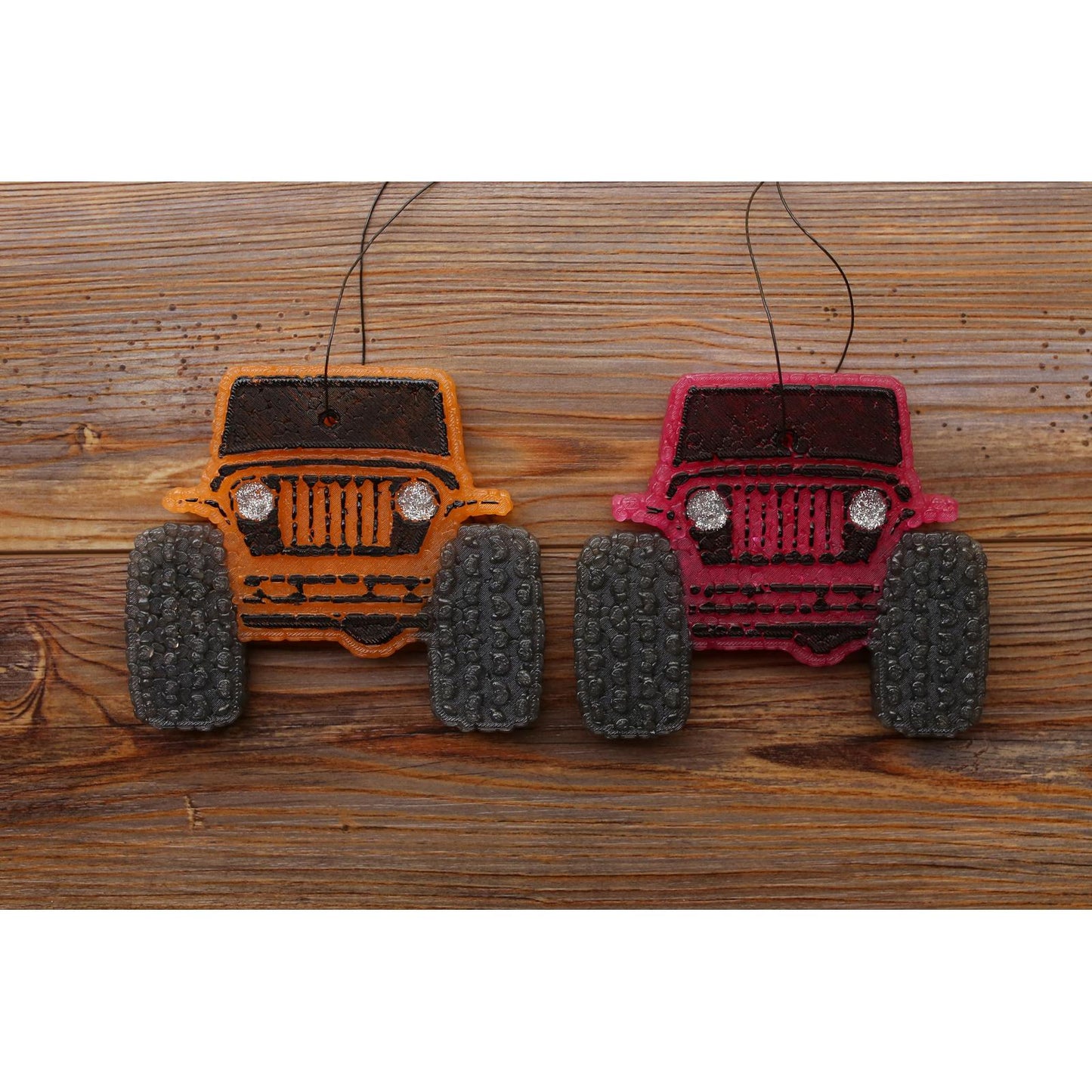 Jeep-inspired car freshies in orange and red with oversized tires and glitter headlights, customizable by color for off-road or adventure lovers