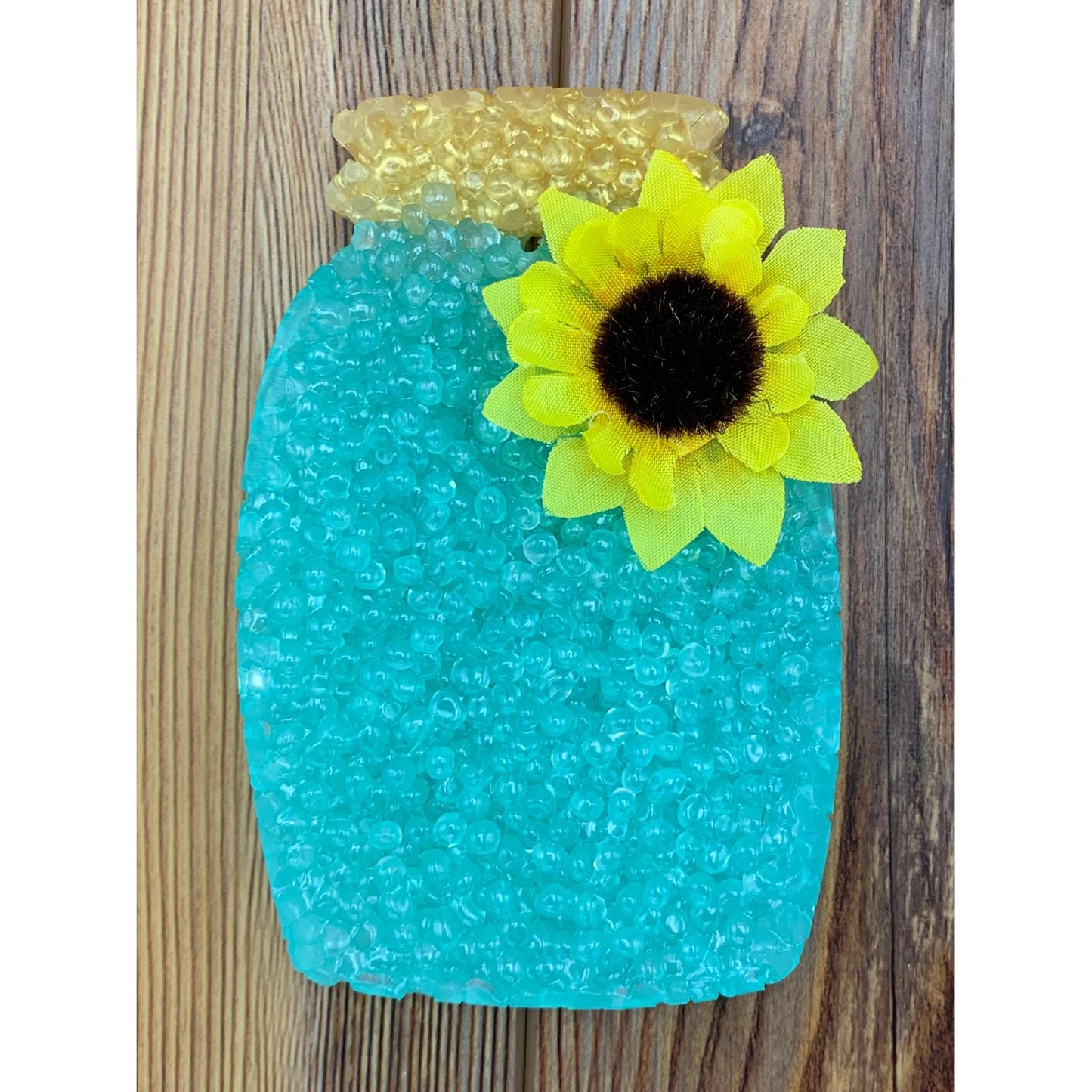 Blue mason jar car freshie with a gold lid and sunflower fabric accent, perfect for farmhouse-inspired scent lovers and seasonal gifting