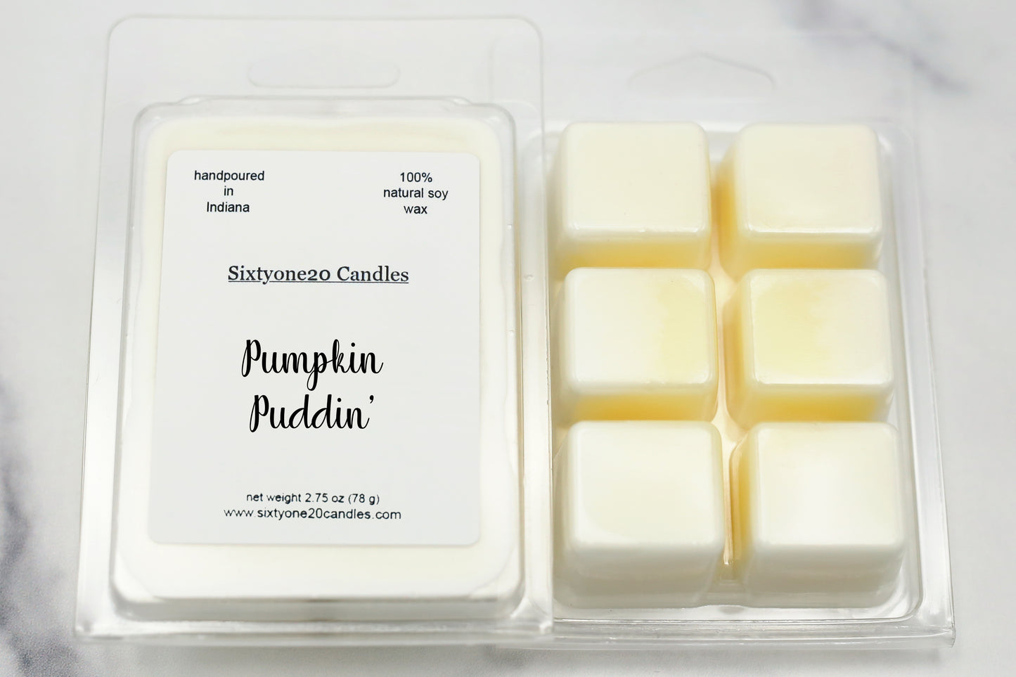 Pumpkin Puddin' soy wax melts in clamshell packaging with six creamy wax cubes, labeled and shown on white marble background