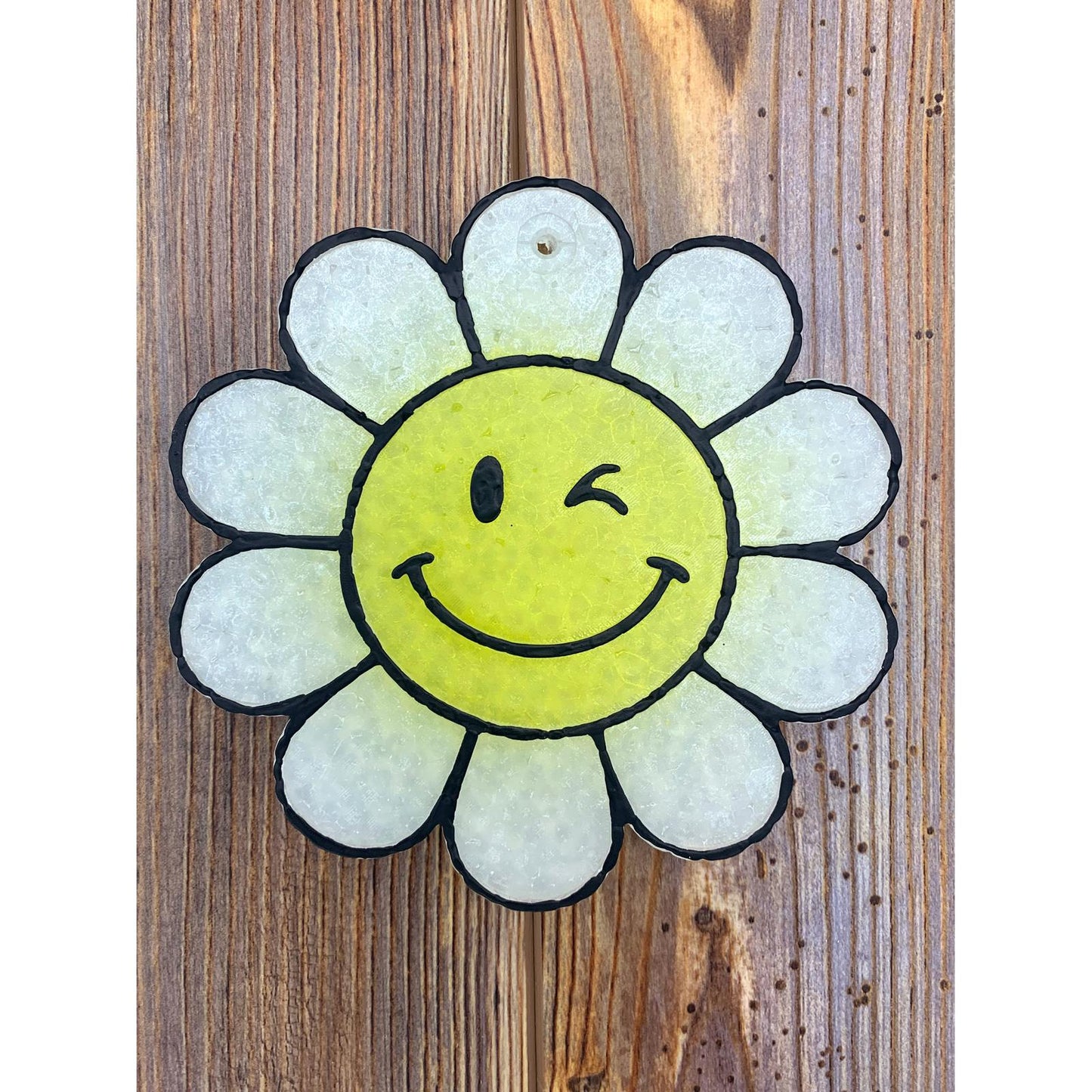 White petal daisy car freshie with a yellow winking smiley face center—playful, cheerful, and perfect for spreading sunshine wherever you go