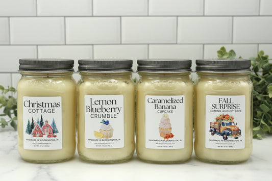 Four Candle Club exclusive 16 oz mason jar candles including Christmas Cottage, Lemon Blueberry Crumble, Caramelized Banana Cupcake, and Fall 2026 surprise fragrance.