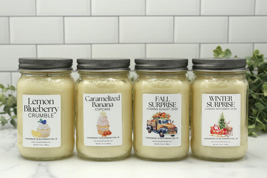 Four Candle Club candles for spring, summer, fall, and winter in 16 oz mason jars with silver lids displayed side by side