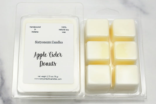 Apple Cider Donuts soy wax melts in clamshell packaging, labeled and shown on marble surface