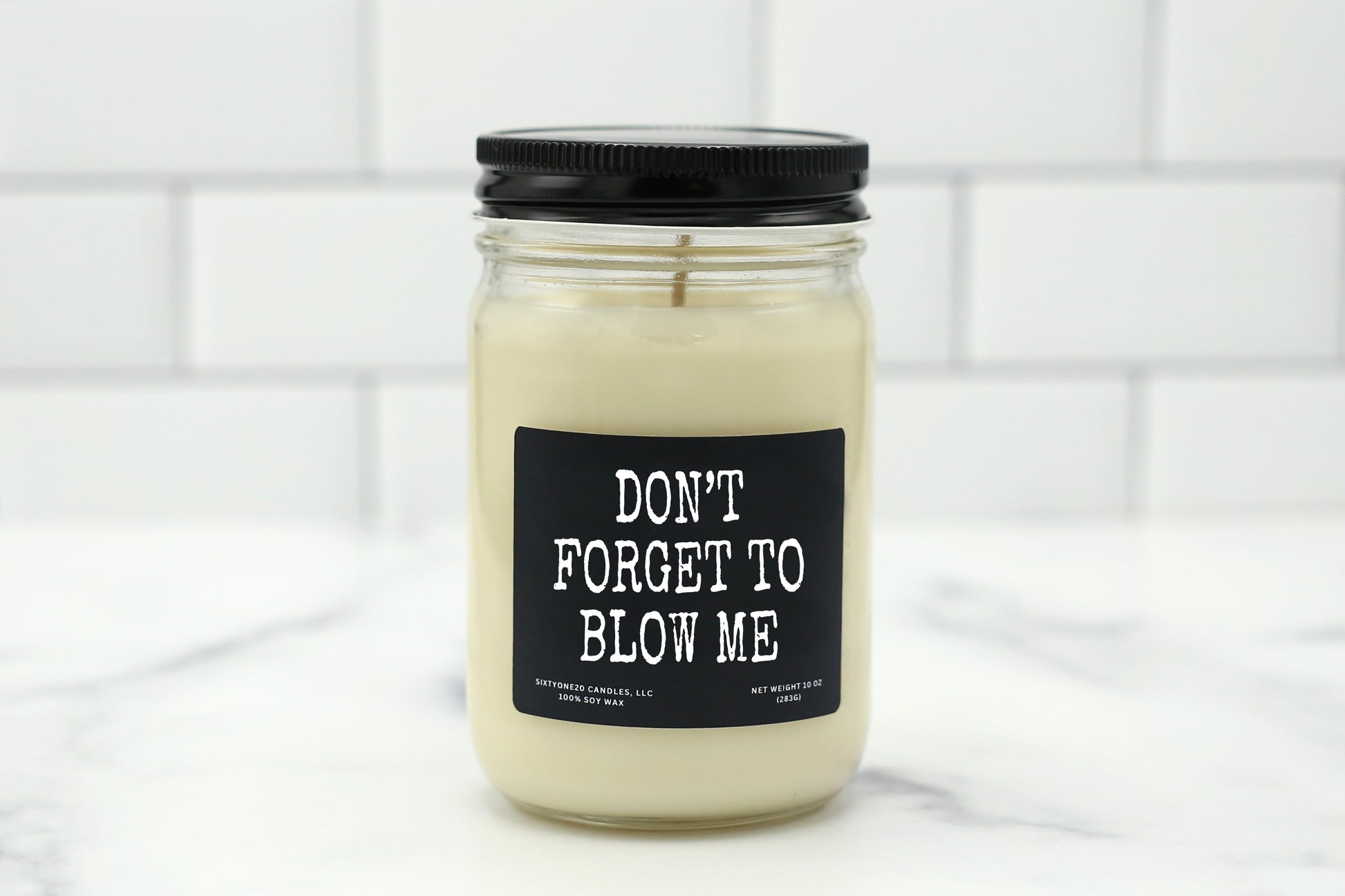 Soy wax candle with the label "Don't Forget to Blow Me" – a funny, flirty gift for couples.