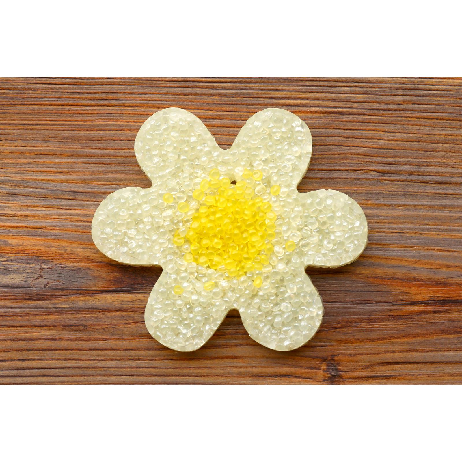 white daisy flower freshie with yellow center on wood background