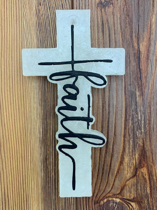 Cross-shaped freshie with the word 'Faith' displayed prominently. The freshie features a detailed design, perfect for adding a touch of inspiration and fragrance to your car or space.