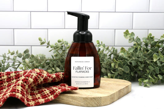 Fallin' for Flapjacks foaming hand soap by Sixtyone20 Candles on a wooden board with red towel and greenery