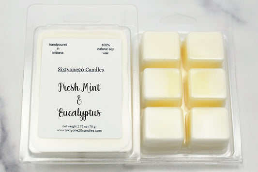 A clamshell of hand-poured soy wax melts labeled "Fresh Mint & Eucalyptus". The melts release a cool, clean scent with notes of mint, verbena, eucalyptus, and greens—perfect for a spa-like home atmosphere.