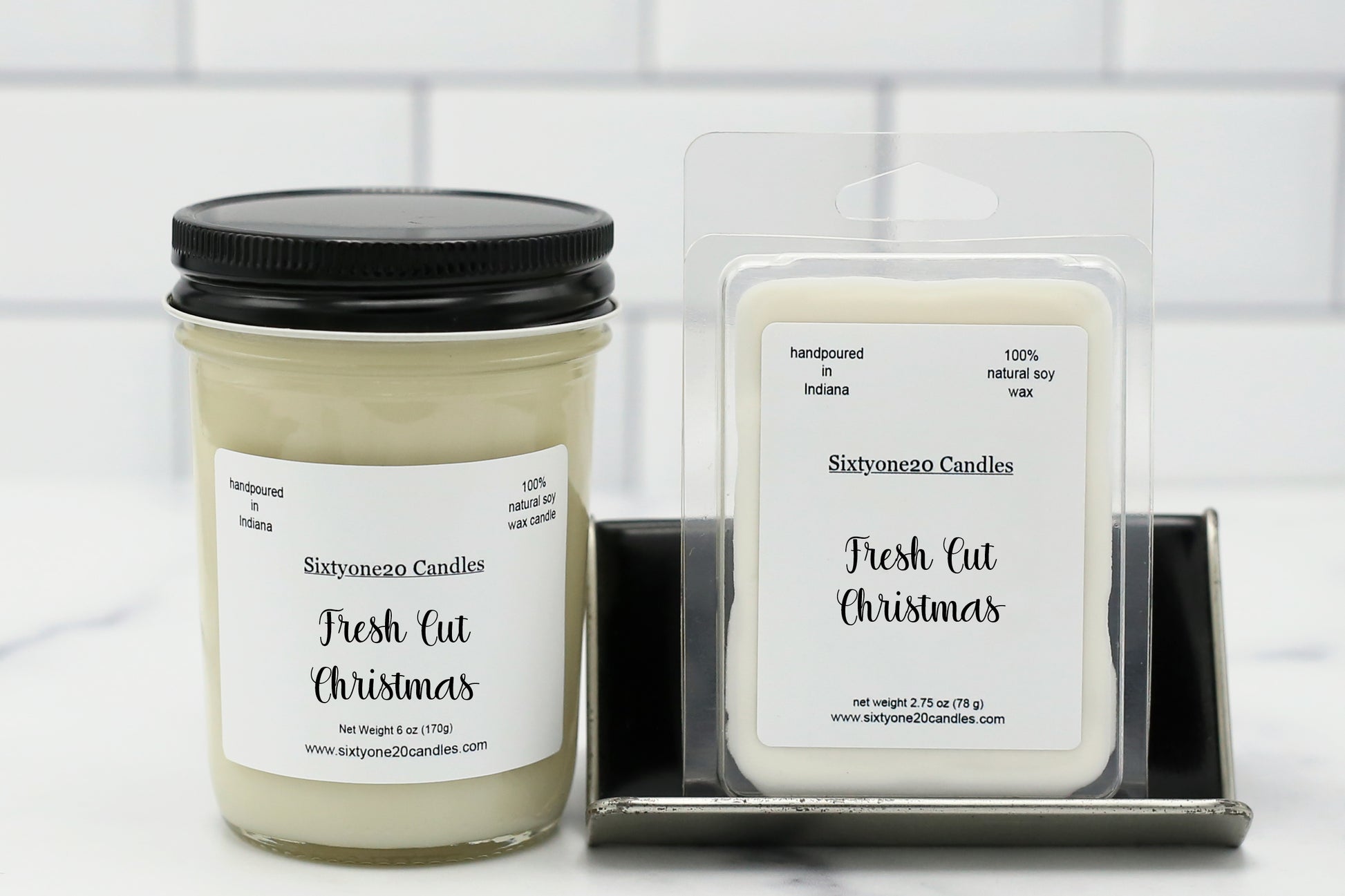 Sixtyone20 Candles 8 oz soy candle and matching wax melt labeled Fresh Cut Christmas, displayed on a clean white background. Hand-poured candle in a clear jelly jar with black lid and matching melt in clamshell from Sixtyone20 Candles, Bloomington, Indiana.