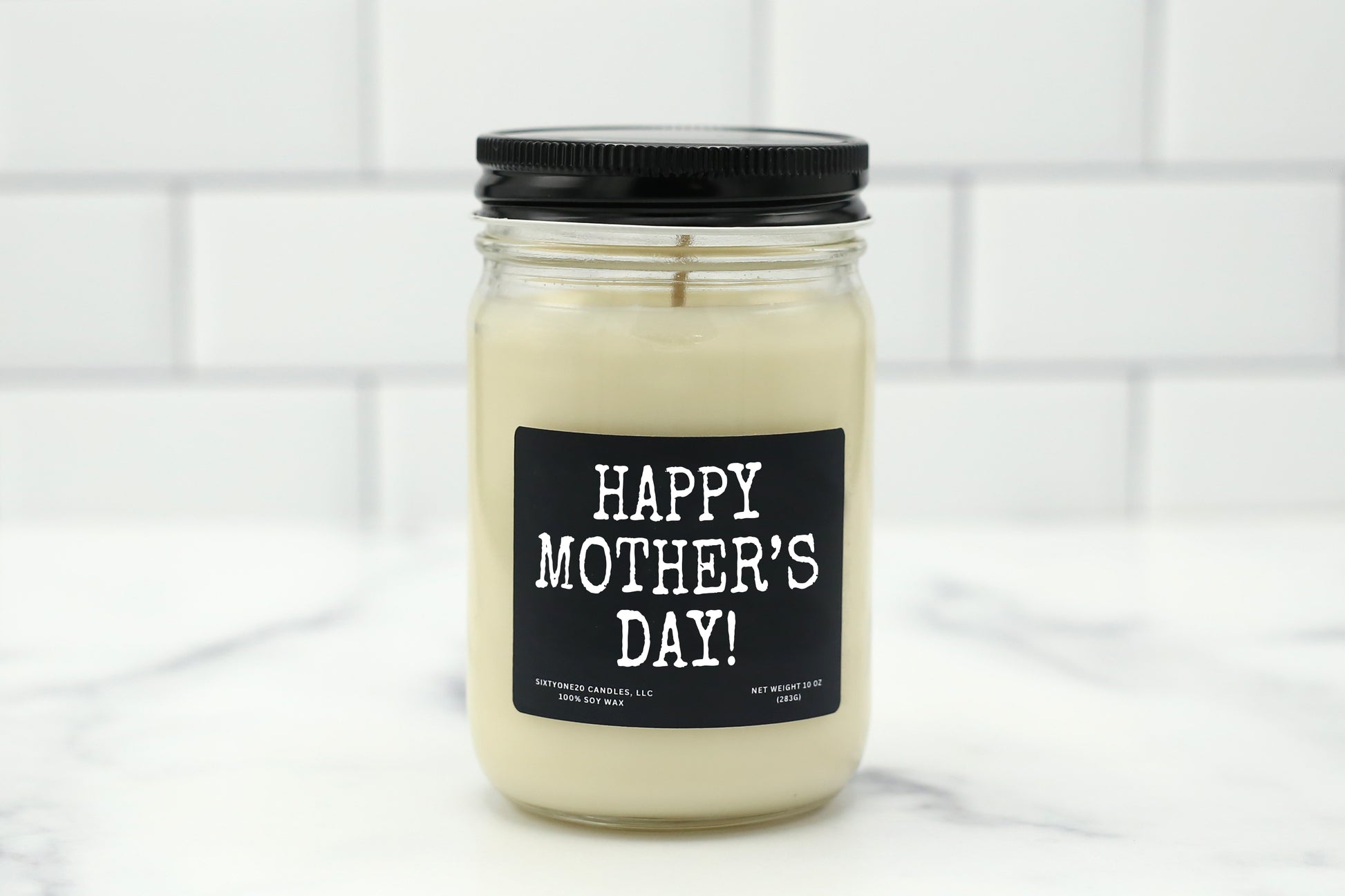 A 10 oz handmade soy wax candle with the label "Happy Mother’s Day!"—a heartfelt gift available in 10 custom scents, perfect for celebrating Mom.