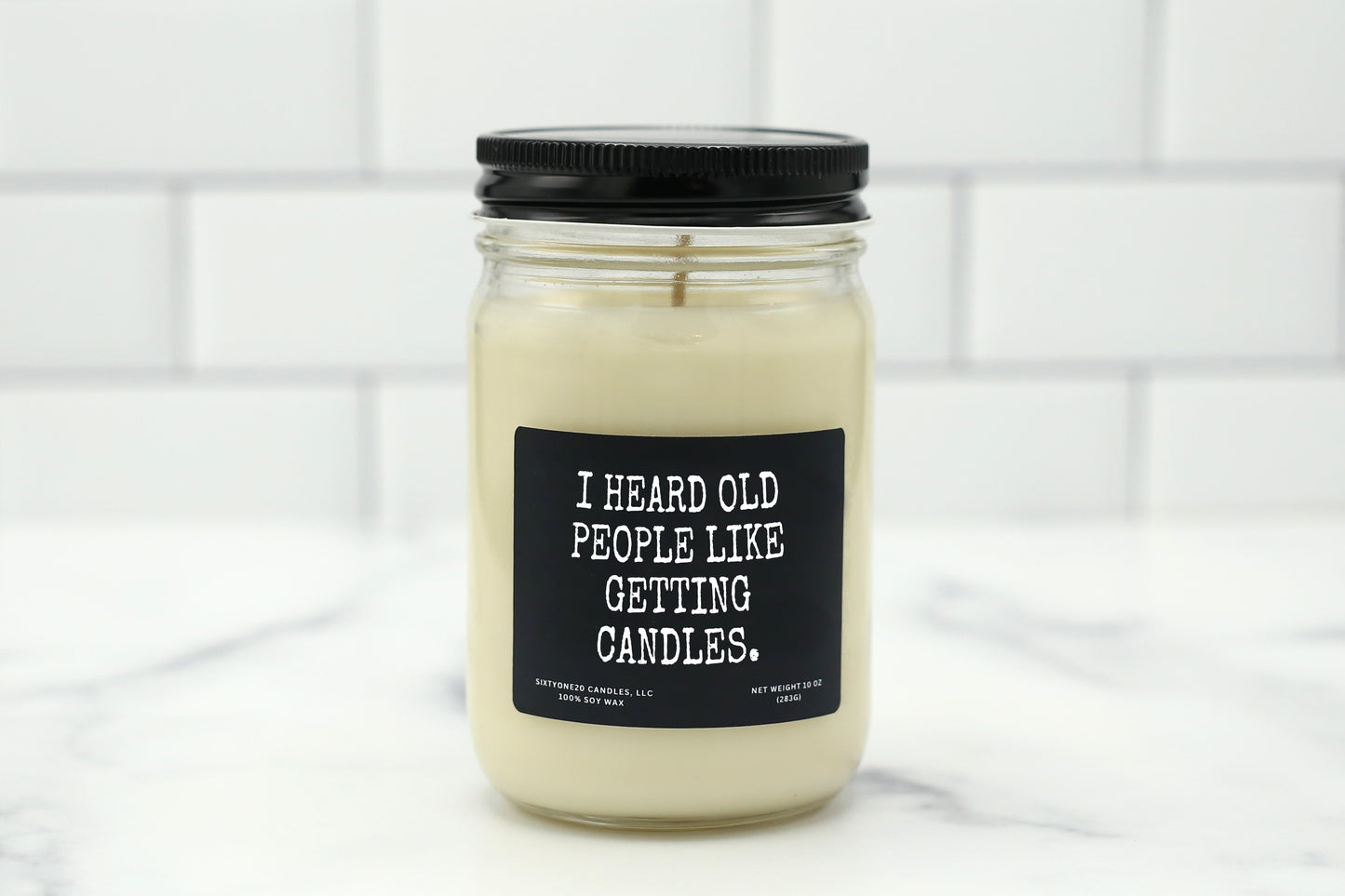 A 10 oz handmade soy wax candle with the label "I Heard Old People Like Getting Candles"—a funny birthday gift available in 10 custom scents, great for milestone birthdays or over-the-hill celebrations.