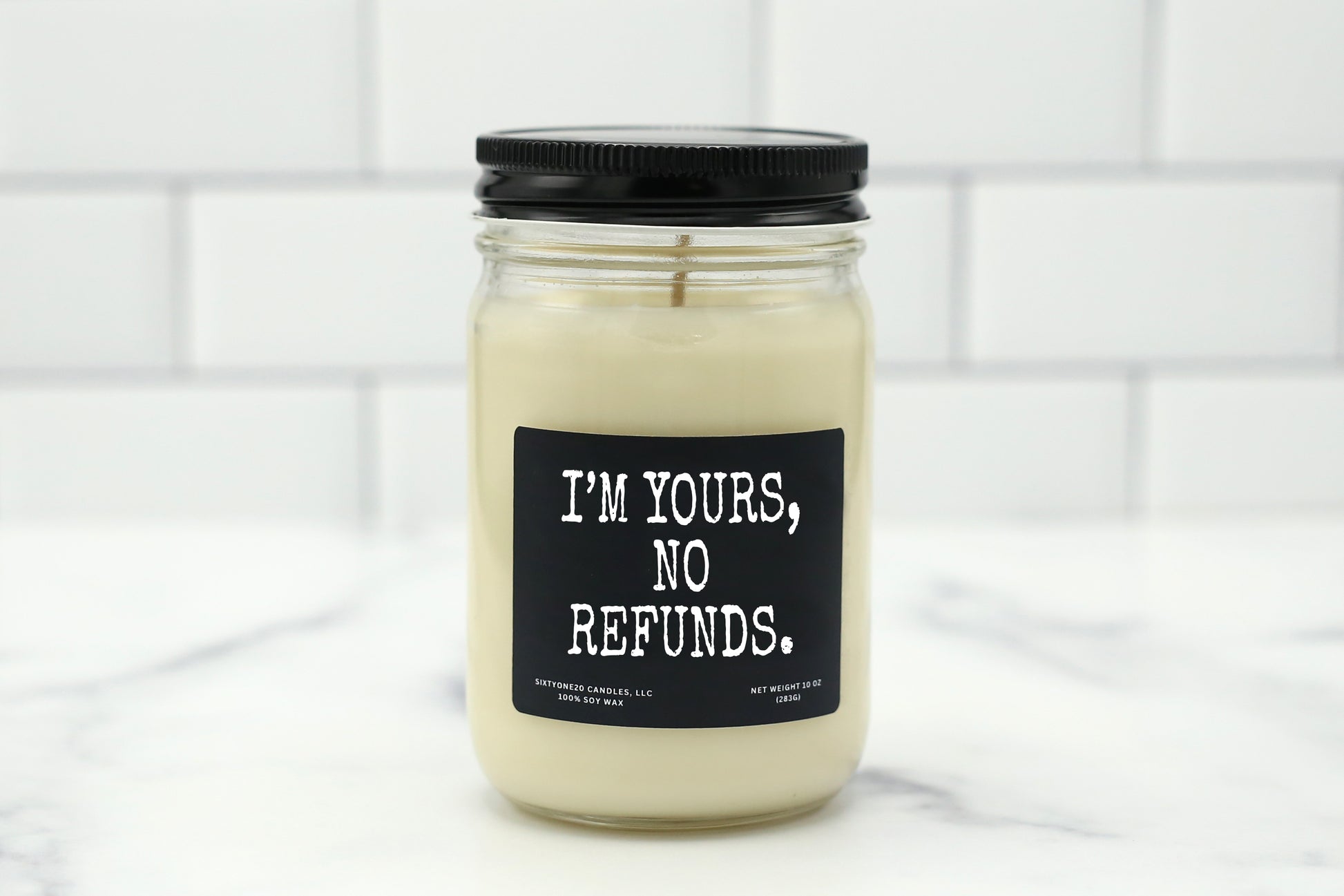 Soy wax candle with the label "I'm Yours. No Refunds." – a funny, bold gift for anniversaries or couples.