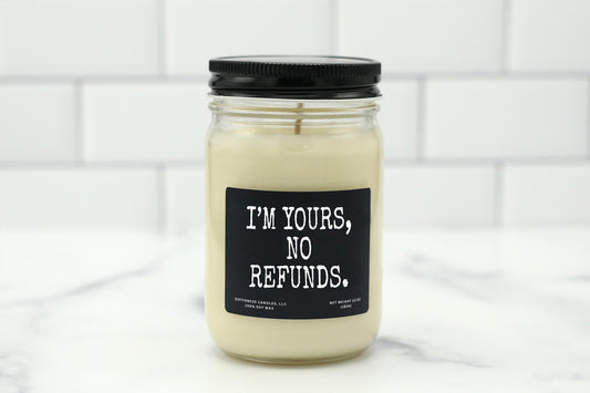 10 oz personalized candle with the saying 'I'm yours, no refunds,' available in various scents, made with natural soy wax.