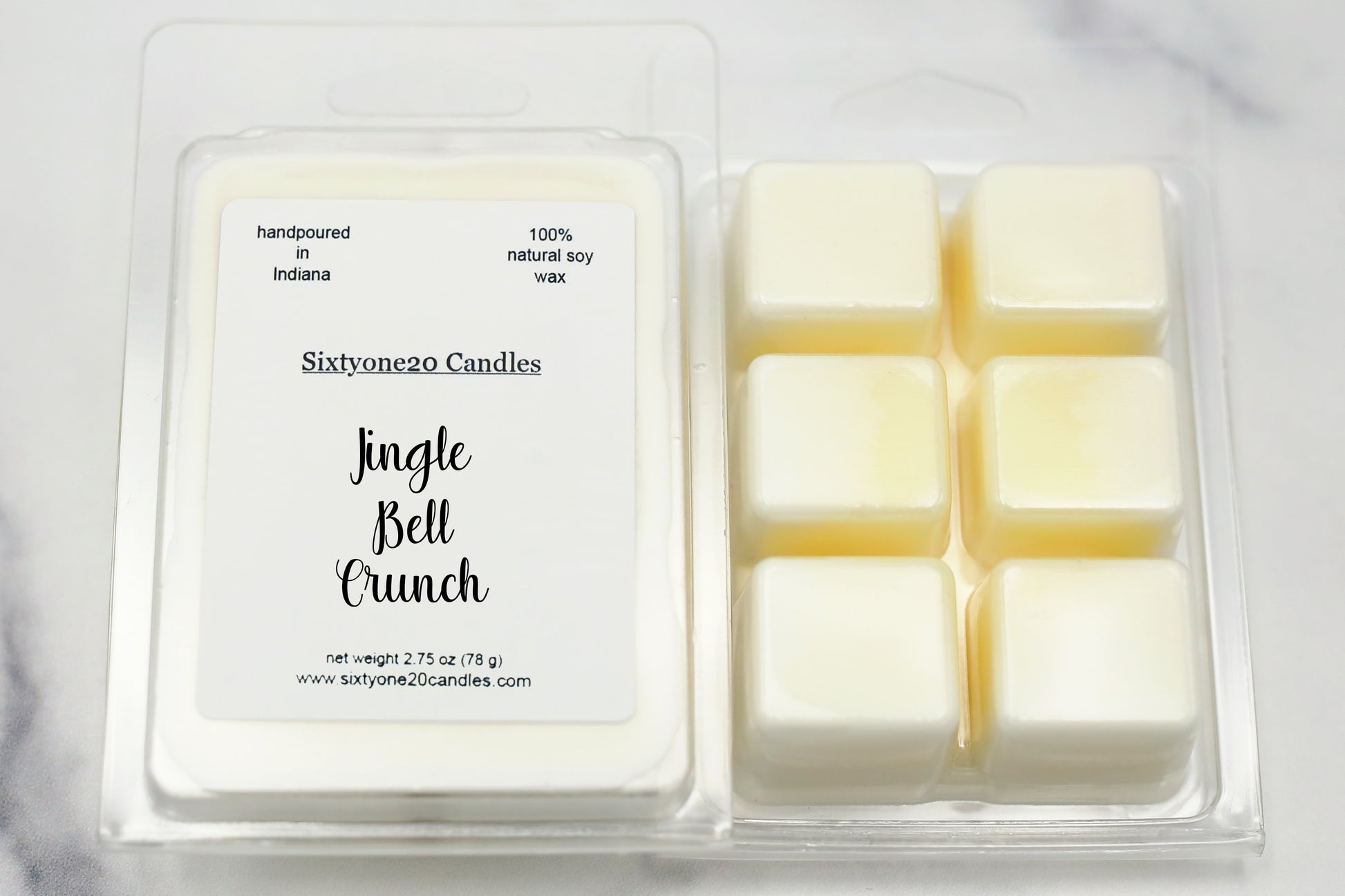 Sixtyone20 Candles soy wax melt labeled Jingle Ball Crunch, displayed on a clean white background. Handmade melt in a clear plastic clamshell from Sixtyone20 Candles, Bloomington, Indiana.