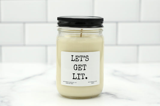 A 10 oz handmade soy wax candle with the label "Let’s Get Lit"—a fun gift available in 10 custom scents, perfect for parties, birthdays, or bachelorette celebrations.