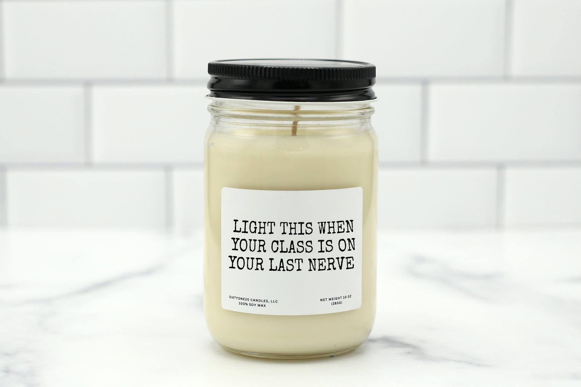 A 10 oz handmade soy wax candle with the label "Light This When Your Class Is on Your Last Nerve"—a funny teacher gift available in 10 custom scents, perfect for teacher appreciation, end-of-year gifts, or stress relief.