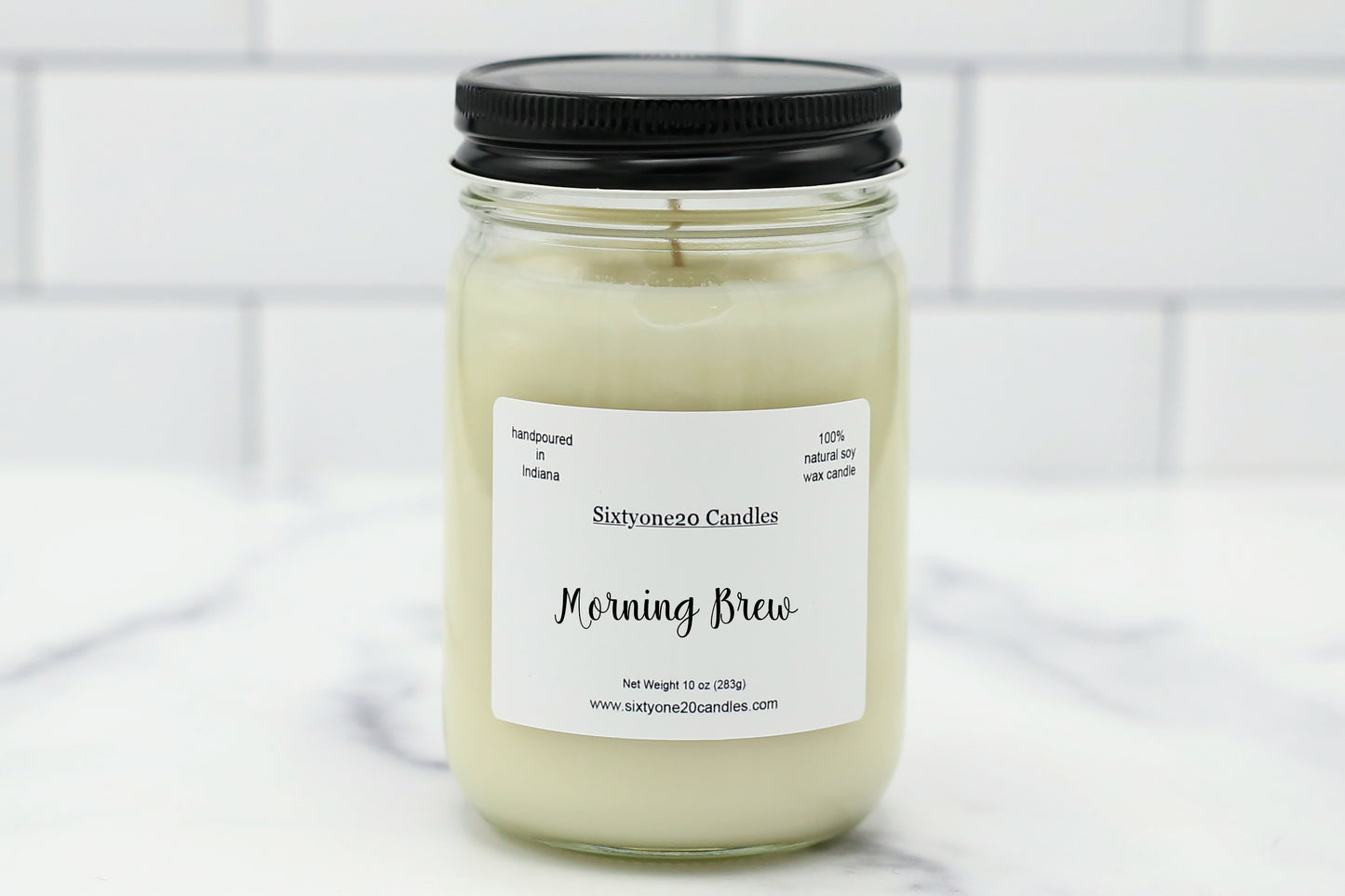 Morning Brew 12 oz soy candle in a clear glass jar with black lid, labeled Morning Brew, hand poured by Sixtyone20 Candles.
