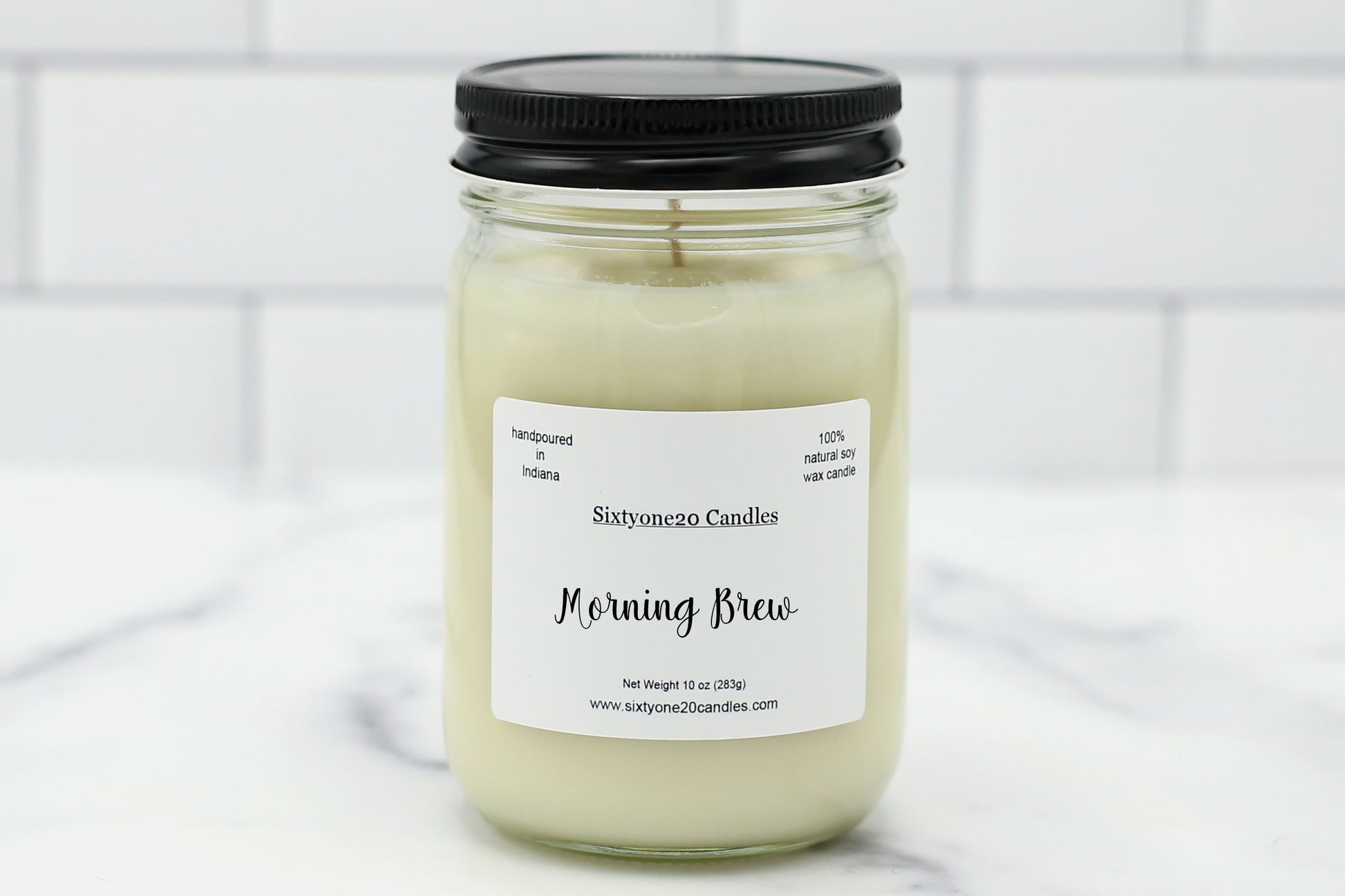 Morning Brew 12 oz soy candle in a clear glass jar with black lid, labeled Morning Brew, hand poured by Sixtyone20 Candles.
