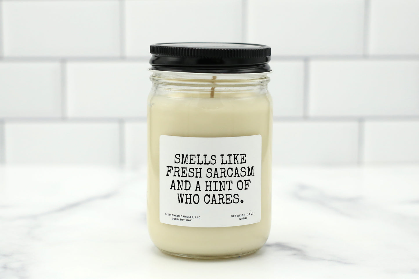 A 10 oz handmade soy wax candle with the label "Smells Like Fresh Sarcasm and a Hint of Who Cares"—a funny gift available in 10 custom scents, perfect for office gifts, birthdays, or everyday sass.