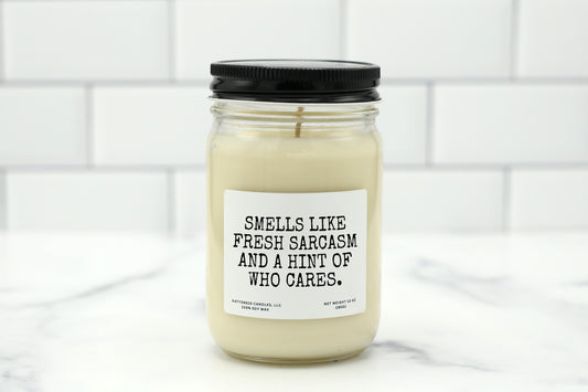 A 10 oz handmade soy wax candle with the label "Smells Like Fresh Sarcasm and a Hint of Who Cares"—a funny gift available in 10 custom scents, perfect for office gifts, birthdays, or everyday sass.