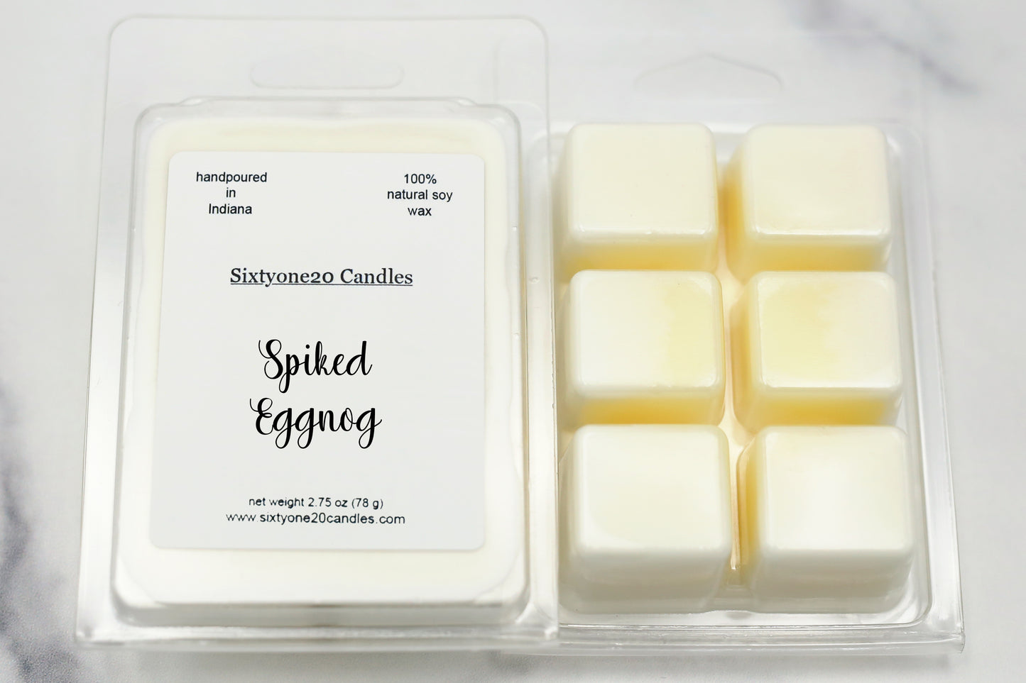 Sixtyone20 Candles soy wax melt labeled Spiked Eggnog, displayed on a clean white background. Handmade melt in a clear plastic clamshell from Sixtyone20 Candles, Bloomington, Indiana.