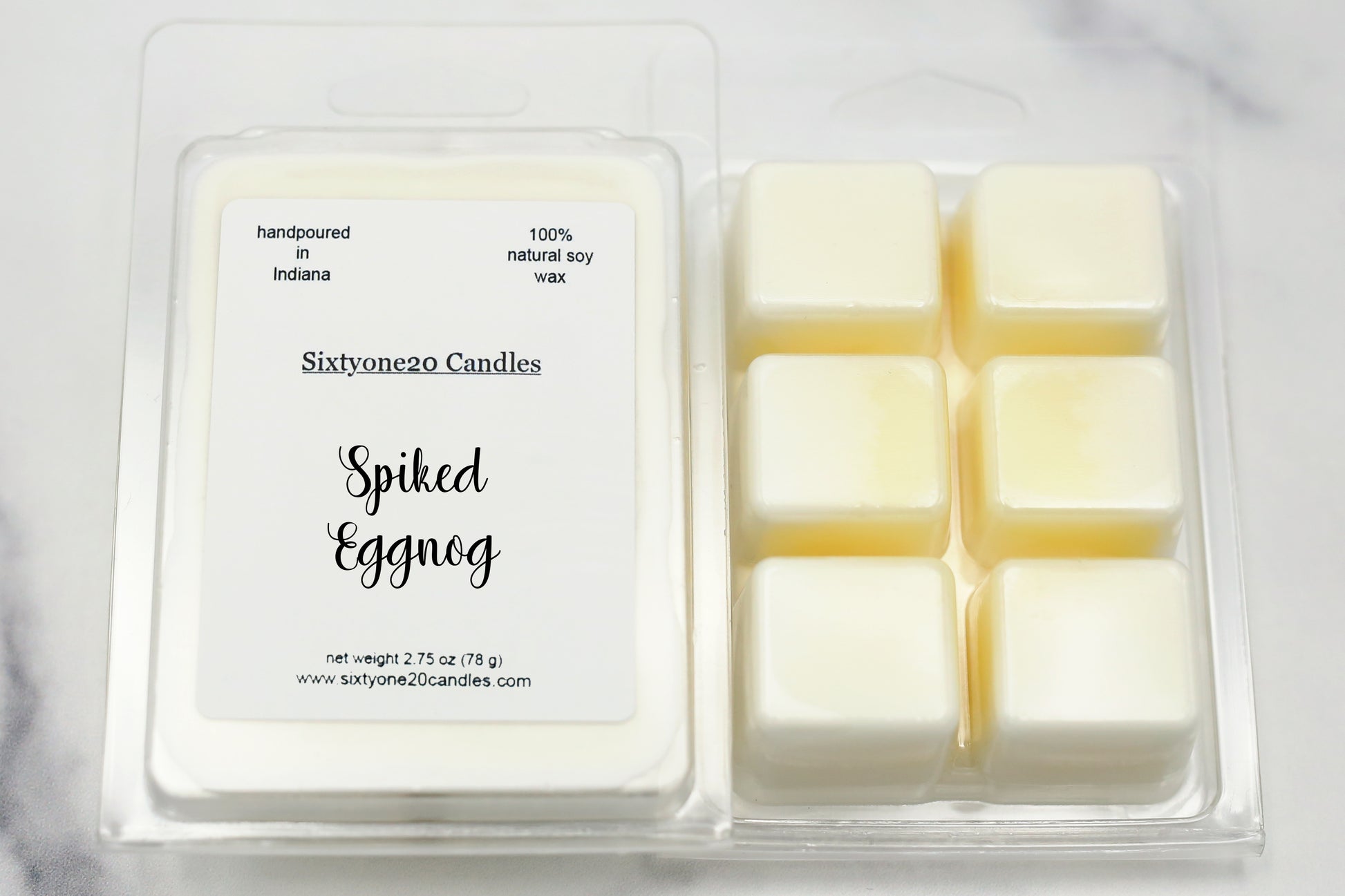 Sixtyone20 Candles soy wax melt labeled Spiked Eggnog, displayed on a clean white background. Handmade melt in a clear plastic clamshell from Sixtyone20 Candles, Bloomington, Indiana.