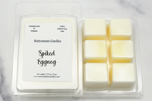 Sixtyone20 Candles soy wax melt labeled Spiked Eggnog, displayed on a clean white background. Handmade melt in a clear plastic clamshell from Sixtyone20 Candles, Bloomington, Indiana.