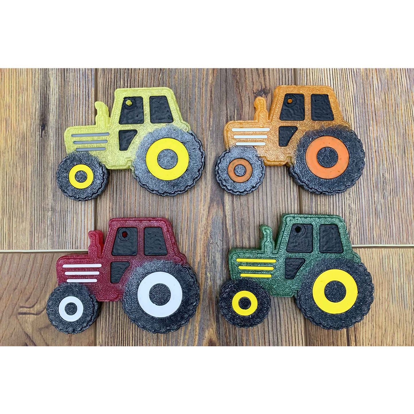 tractor car freshies in green red orange and yellow on wood background